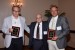 Dr. Nagib Callaos, General Chair, giving Prof. Osmo Kivinen and Lecturer Juha Hedman a plaque "In Appreciation for Delivering a Great Keynote Address at a Plenary Session."